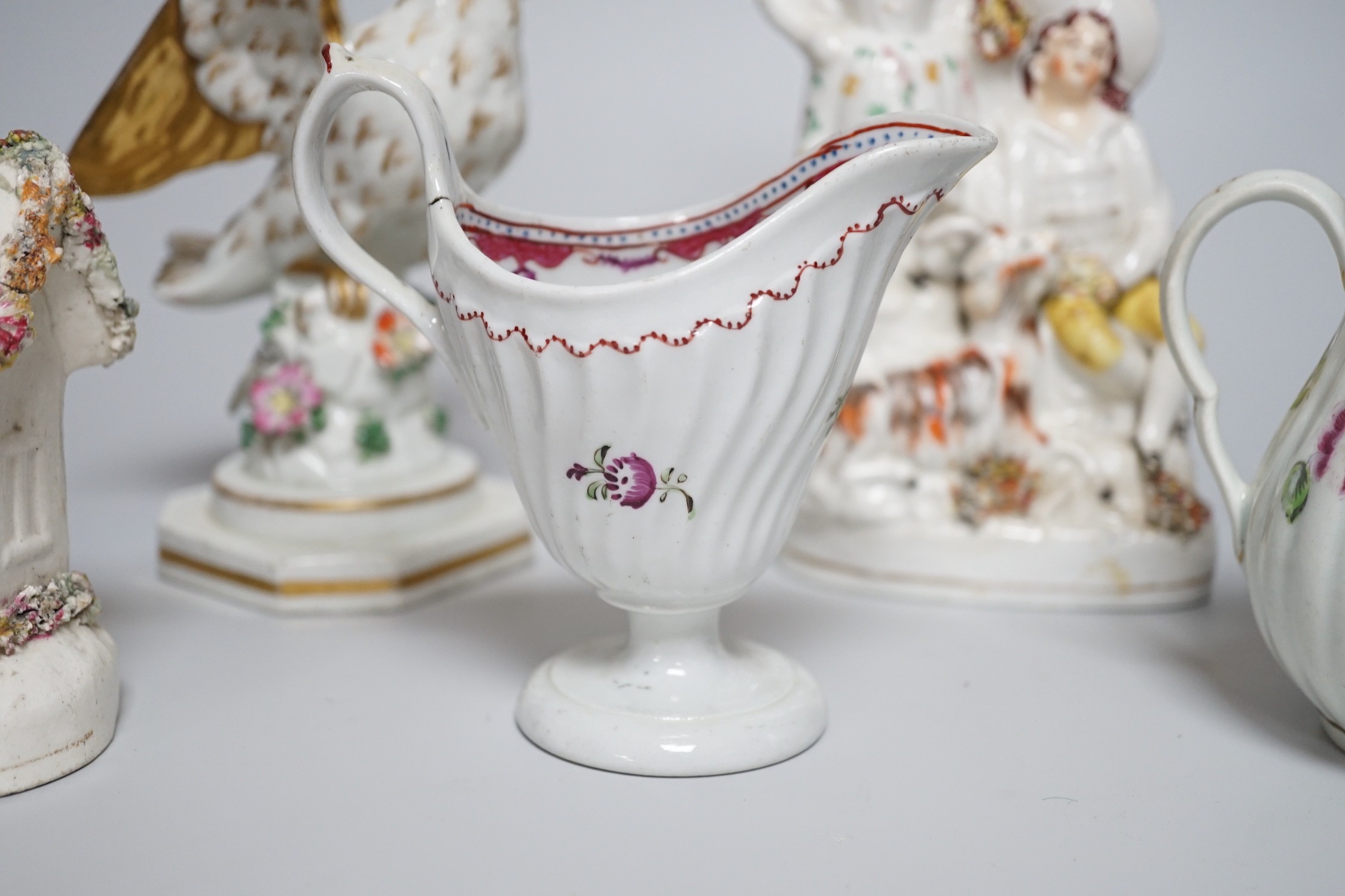 A Worcester milk jug, c.1780, a Newhall-type cream jug, c.1795, a Staffordshire porcelain model of an eagle, c.1830-40, 17cm high, and two Staffordshire porcellaneous models